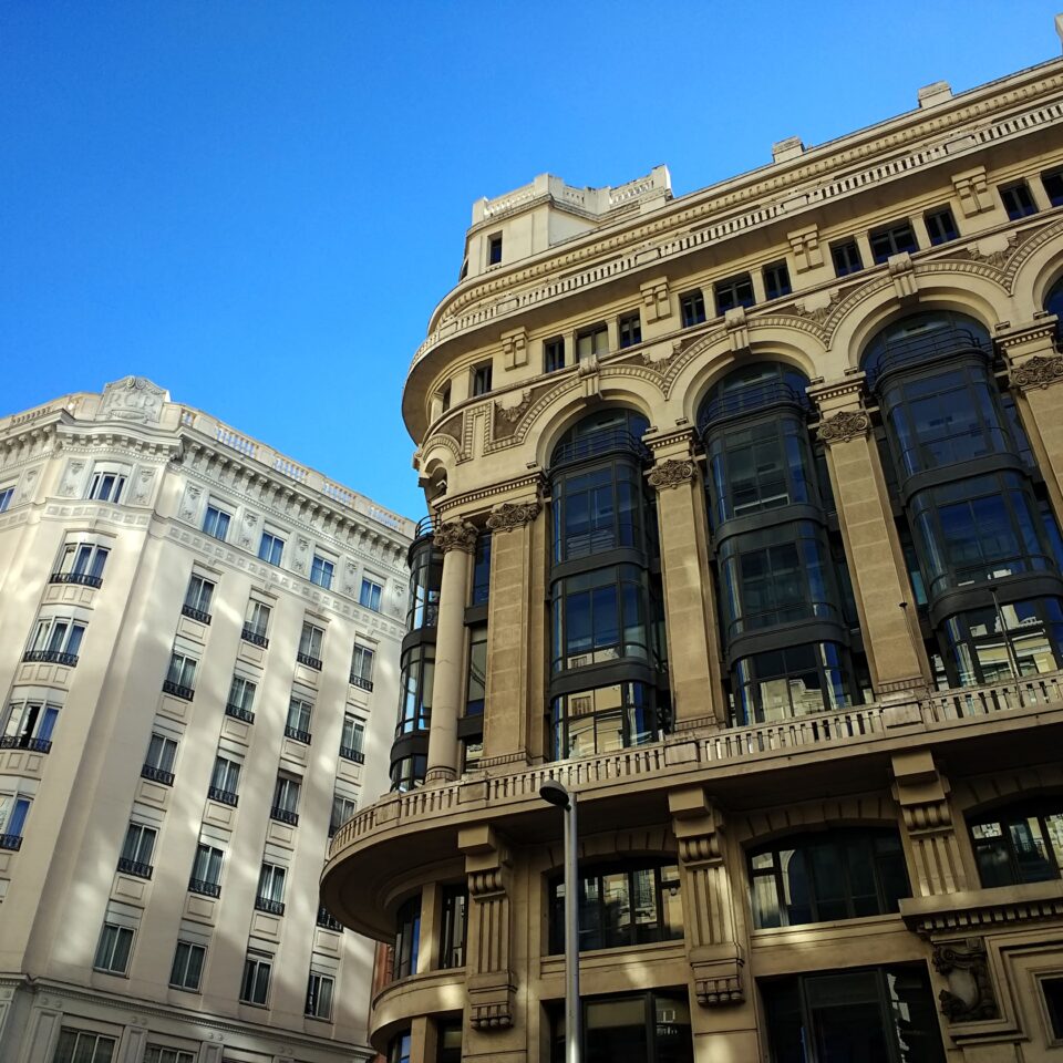 low-angle-shot-buildings-spain-clear-blue-sky (1)